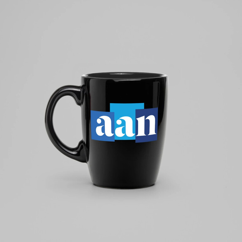 AAN logo on a black mug