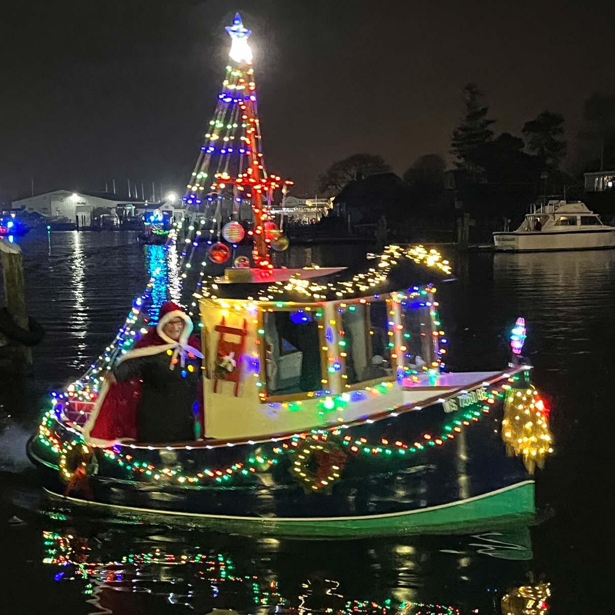 Tug boat in hyannic Christmas parade with Christmas lights