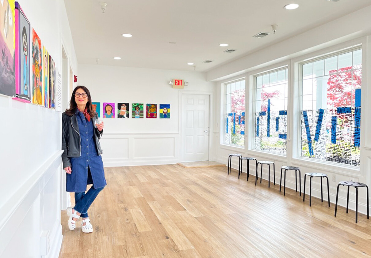 Creator-curator Susan Battista stands in the hyphen art gallery