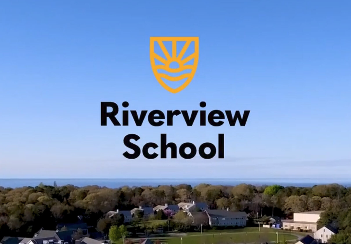 Riverview School logo over campus view from drone