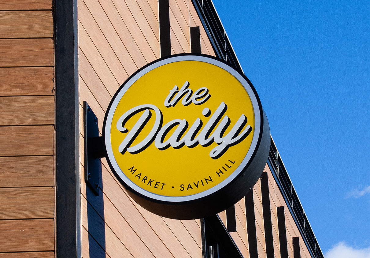 The Daily exterior signage close-up.