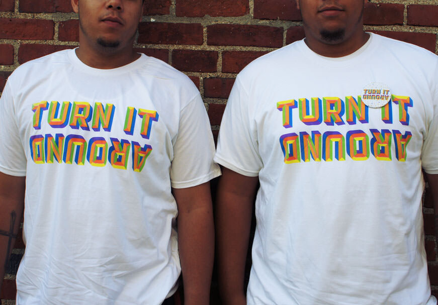 Turn It Around t-shirts on students