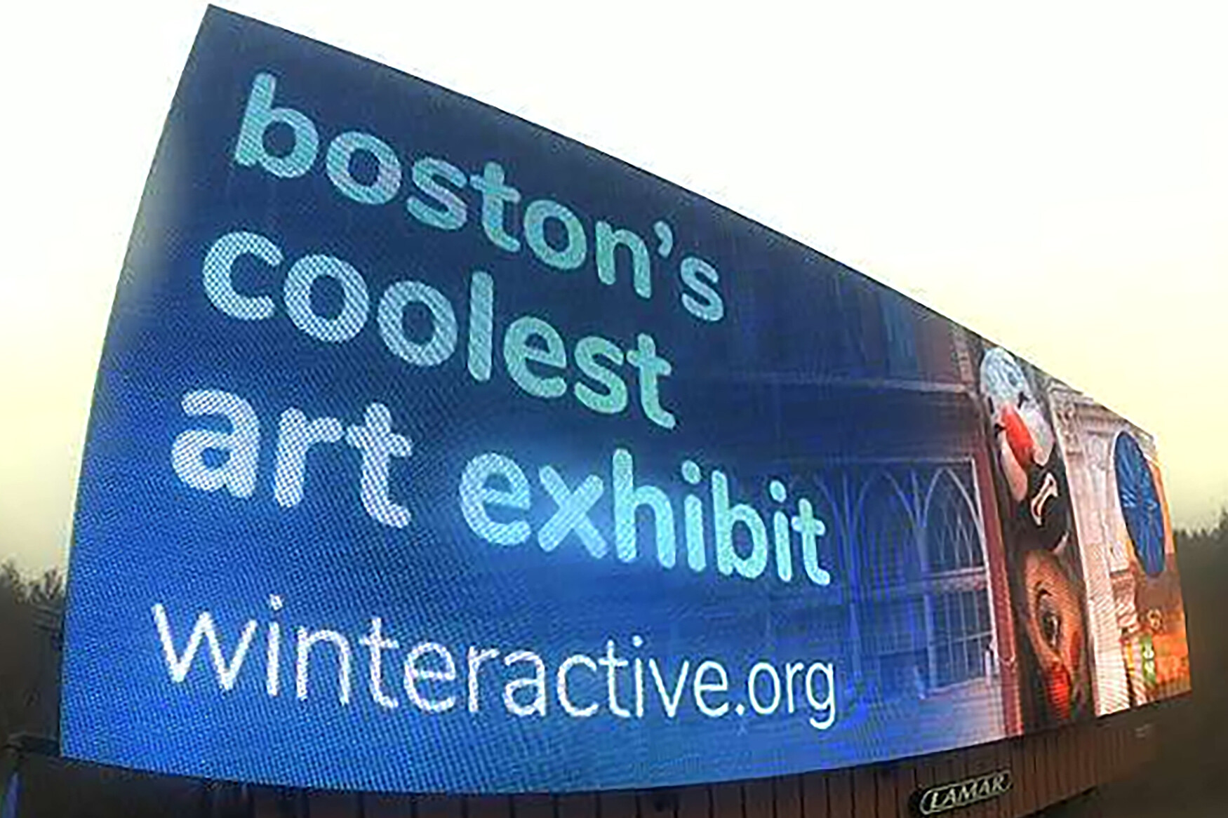 Digital billboard showing “boston’s coolest art exhibit - winteractive.org” with image of Nag & Nell